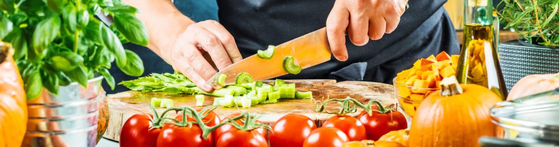 The chef slicing vegetables.